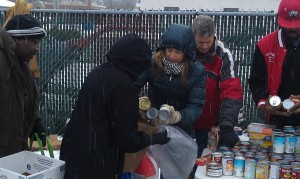 Congressman Bill Huizenga and his family help hand out food at The Beat's 2013 giveaway.