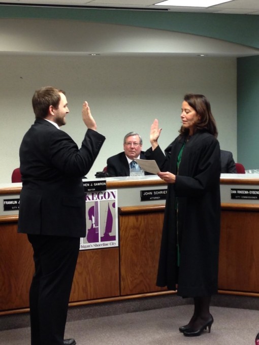 Commissioner Ken Johnson is sworn in by 60th Circuit Court Judge Maria Ladas Hoopes on January 2, 2014.